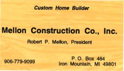 Business card for Mellon Construction Co., Inc. with contact info and a wood-grain background.