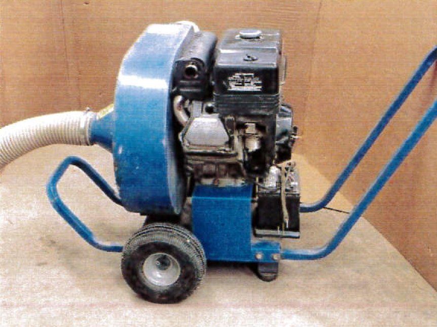 Blue wheeled leaf blower with a gas engine.