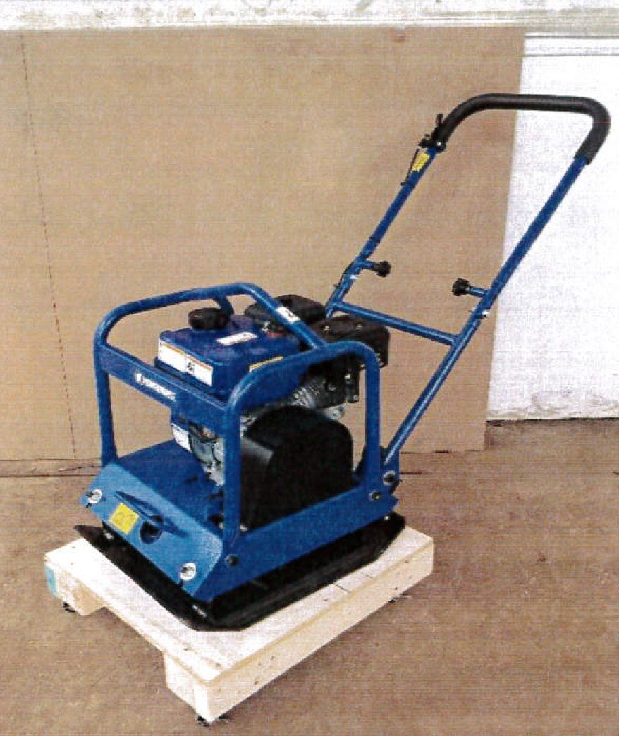 Blue and black plate compactor on a wooden pallet.