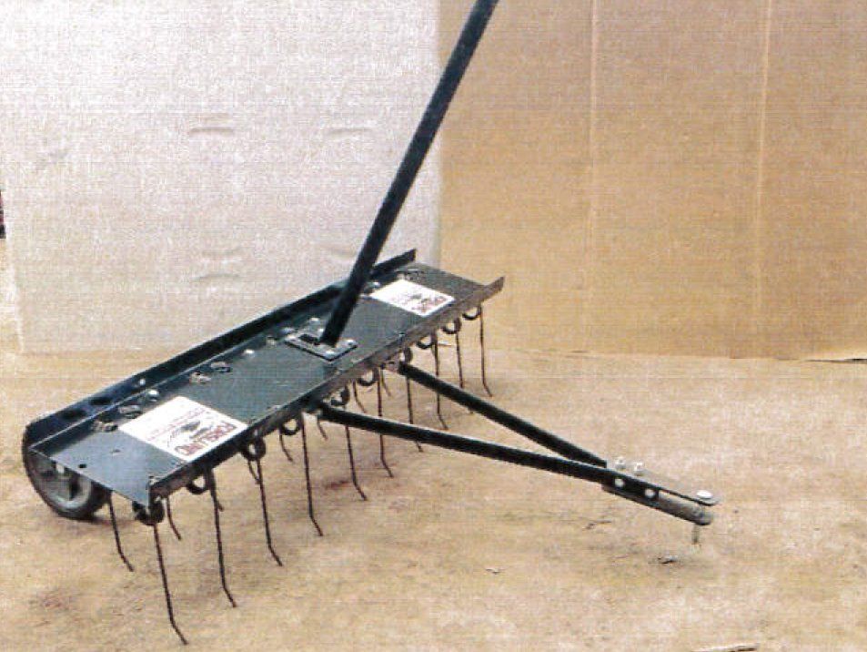 A black lawn thatcher with wheels and tines, used for lawn care.