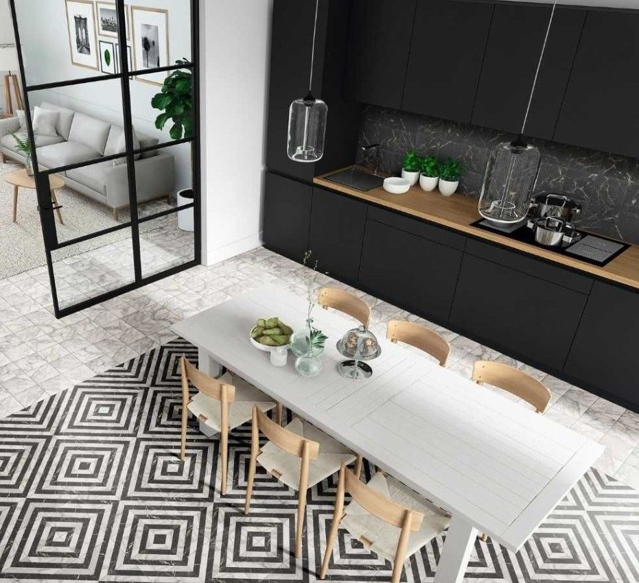 An aerial view of a kitchen with a table and chairs