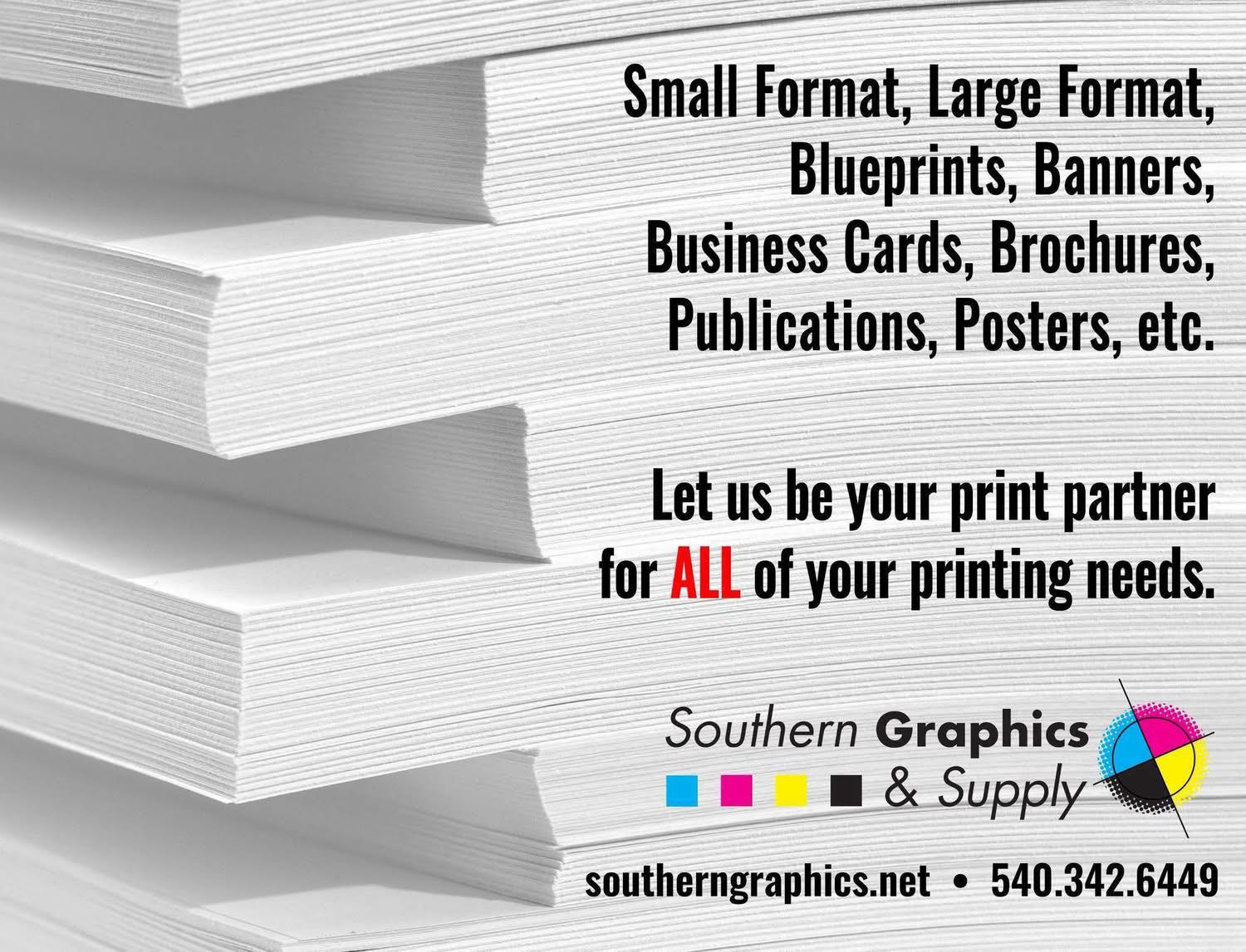 A stack of white paper against a text advertisement for Southern Graphics & Supply with phone number and website.