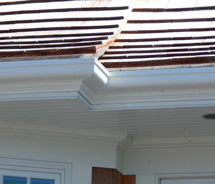 White house trim with light brown roof and gutter.