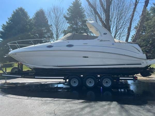 A white trailer with the word macro on it