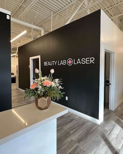 A modern reception area with a black wall featuring the