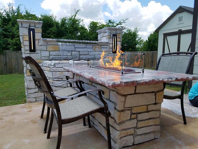 There is a fire pit in the middle of the table.