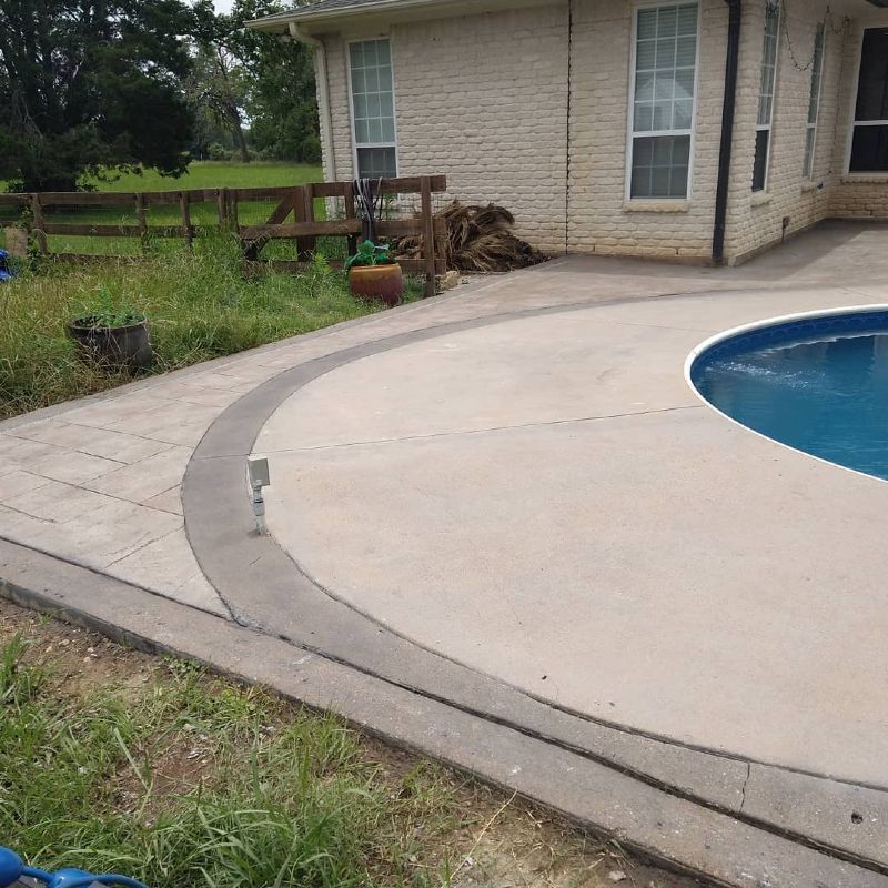 A house with a swimming pool in front of it