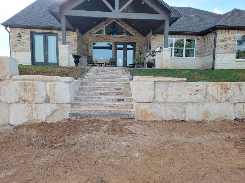 A large house with stairs leading up to it