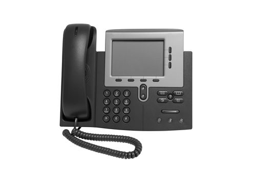 Gray office desk phone with handset, keypad, and display screen