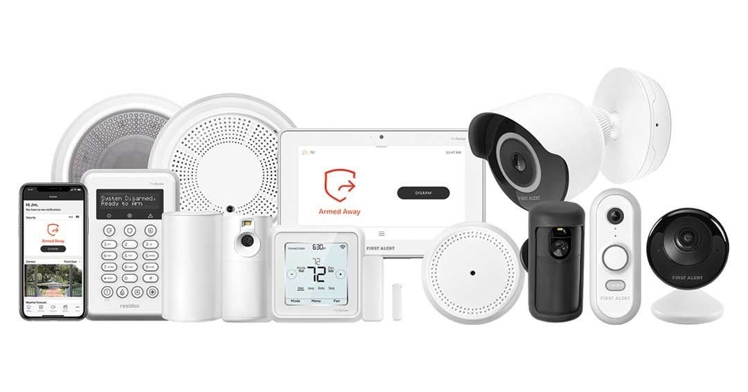 Collection of white and black home security devices, including cameras, a keypad, and control panel.