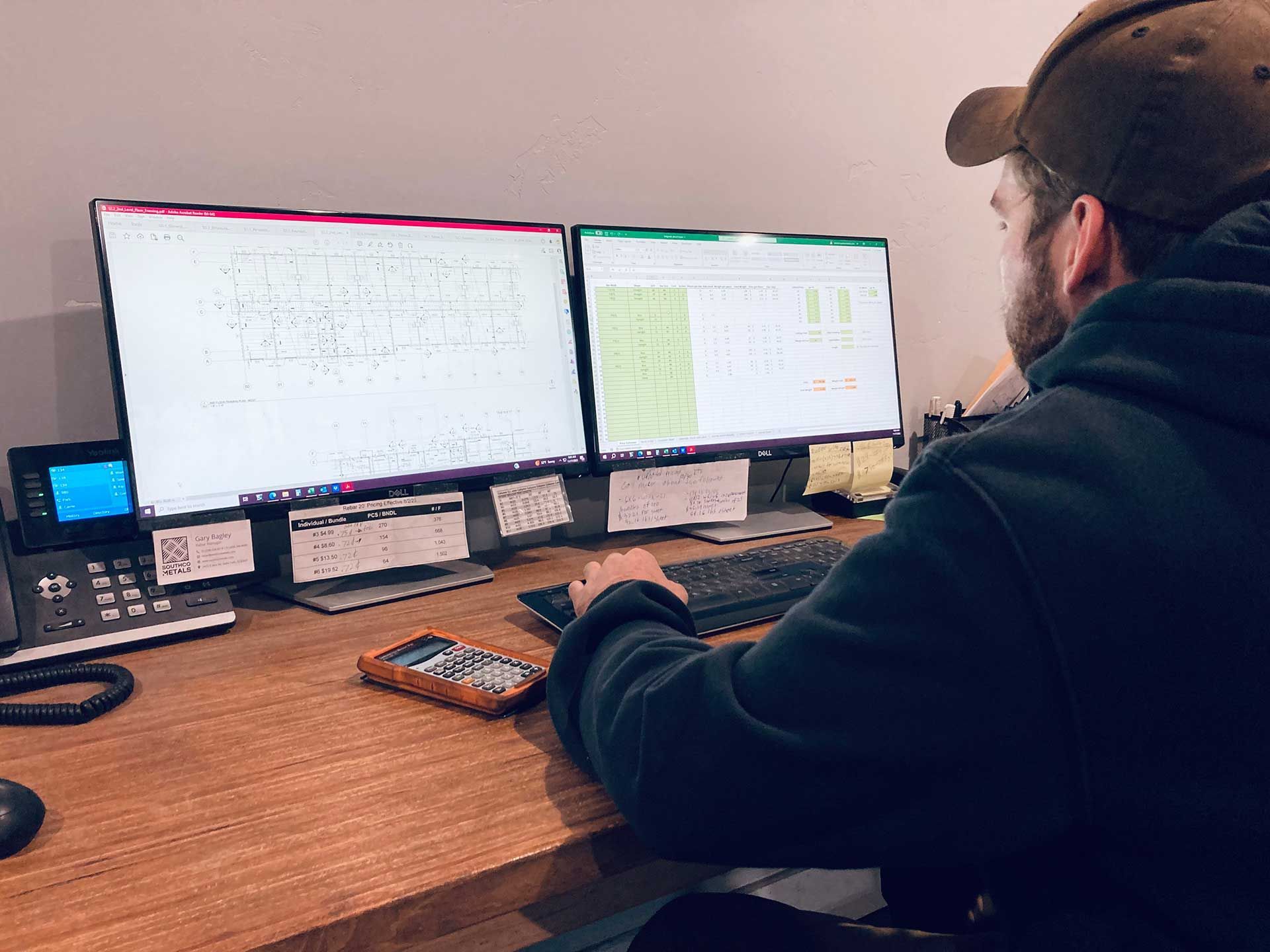 man preparing cost estimates