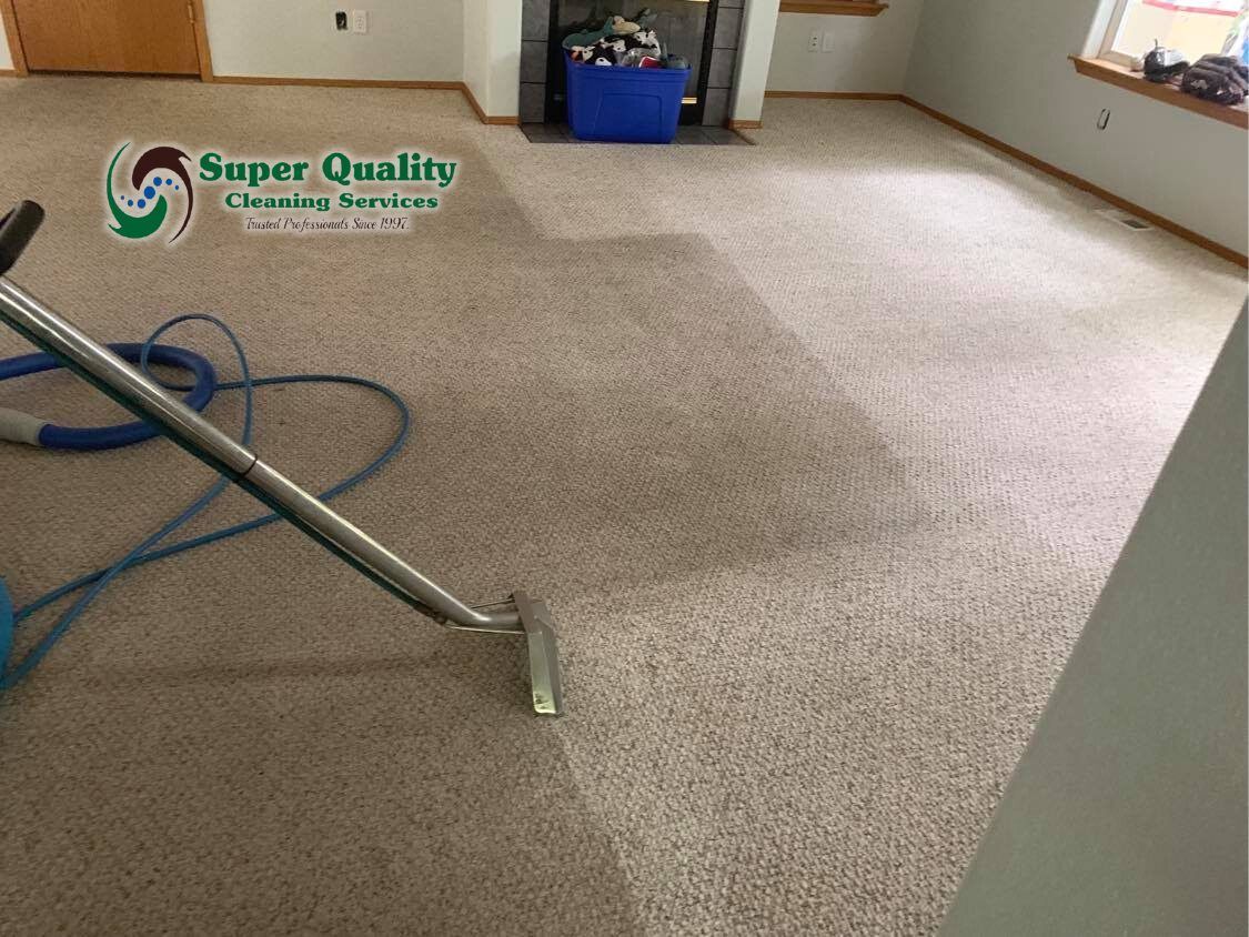 Carpet being cleaned with a machine