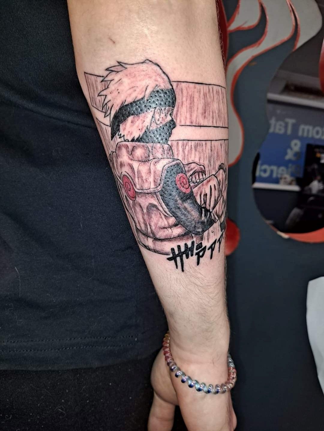 A person has a tattoo on their arm that says ' i love you '