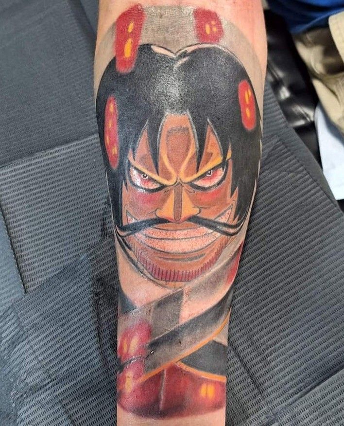 A person has a tattoo of a man with a mustache on their leg.