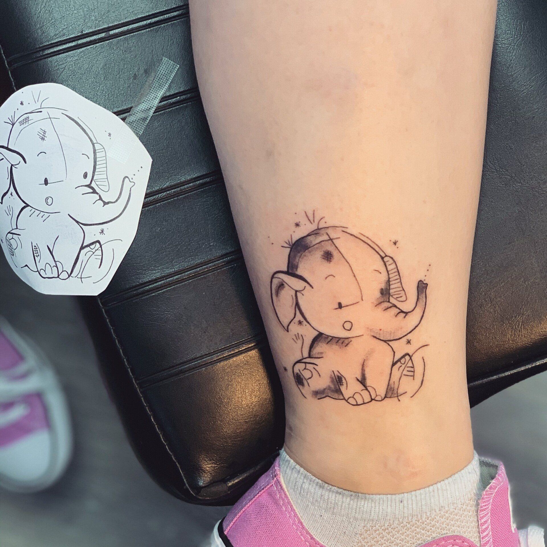 A woman has a tattoo of an elephant on her leg