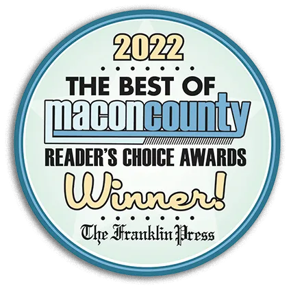 2022 The Best of Macon County award seal. Blue, white, and gold colors. Text: Reader's Choice Awards Winner!