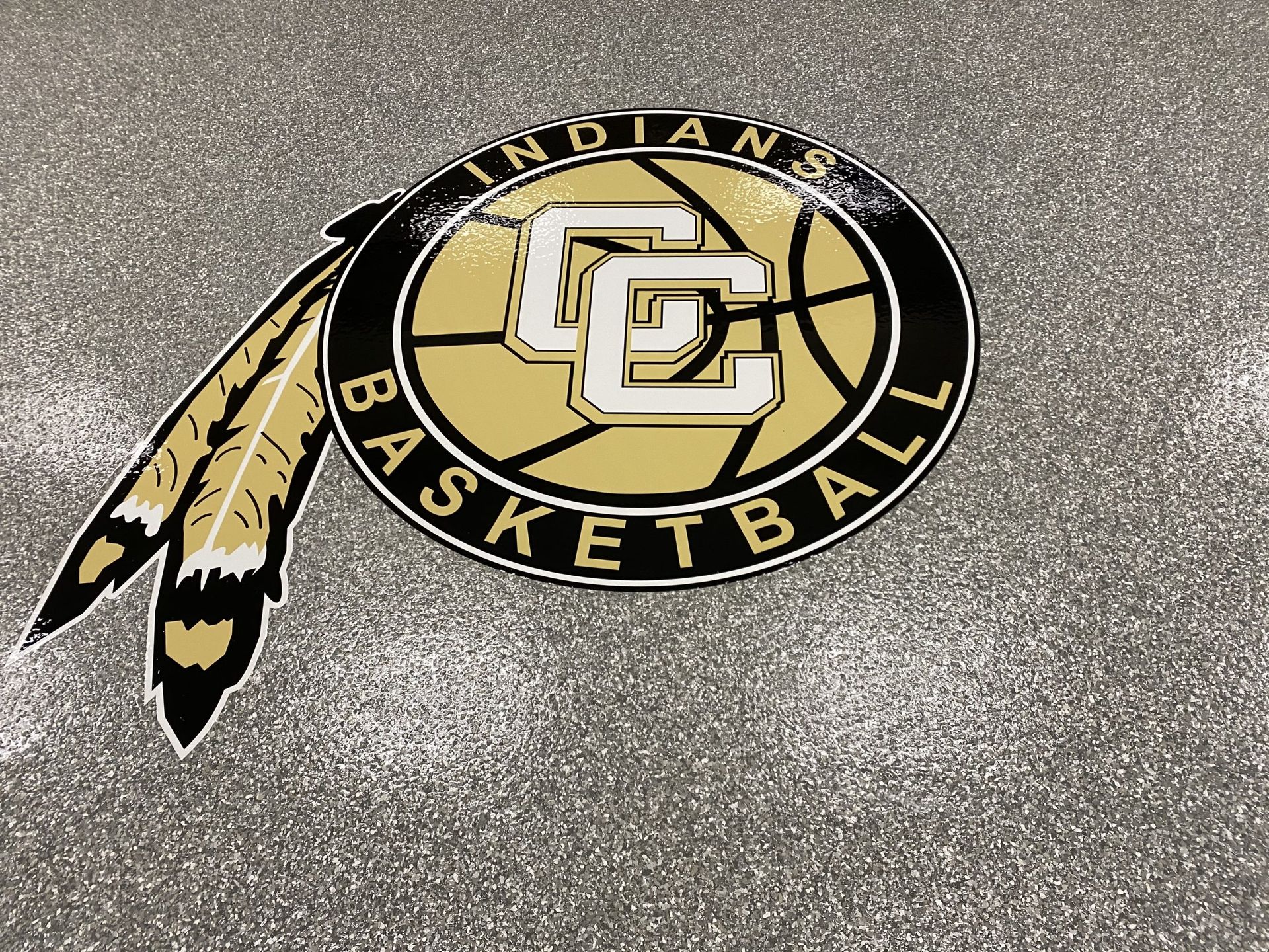 CC Indians Basketball logo with feathers, gold and black colors.