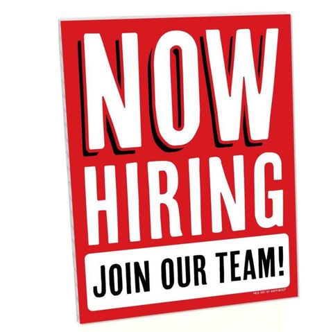 Red sign reading “NOW HIRING” with “JOIN OUR TEAM!” in white text