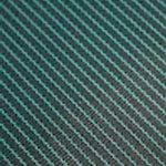 A close up of a green and black striped fabric.