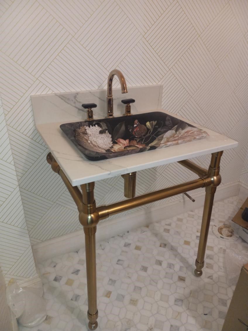 A bathroom sink with a faucet on top of it