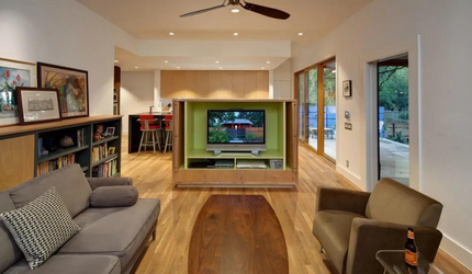 A living room with a couch a chair and a television