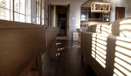 A living room with a couch and chairs and a table