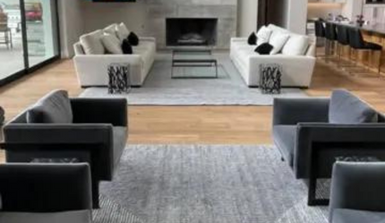 A living room filled with furniture and a fireplace.