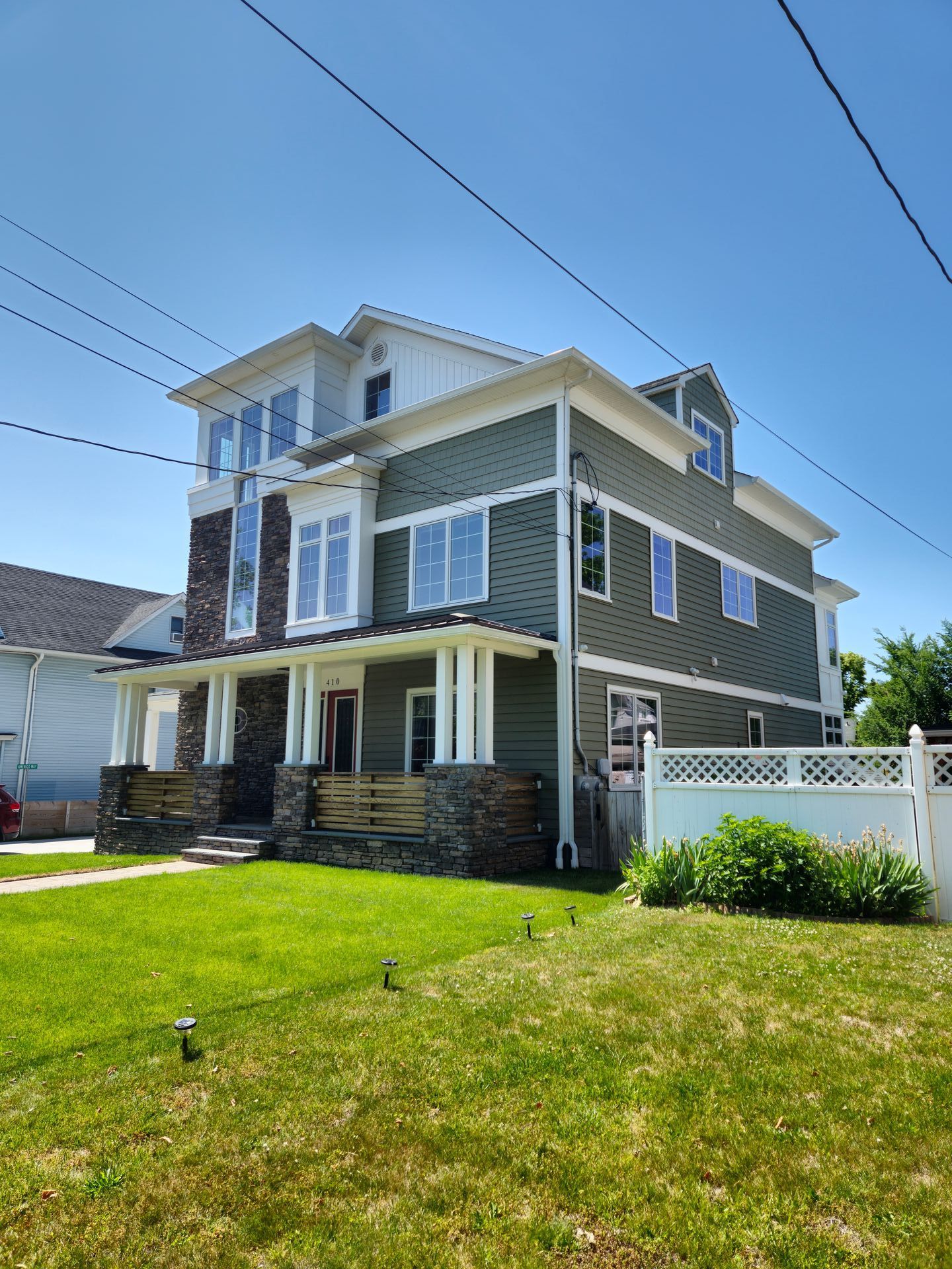 A large house with a lawn in front of it