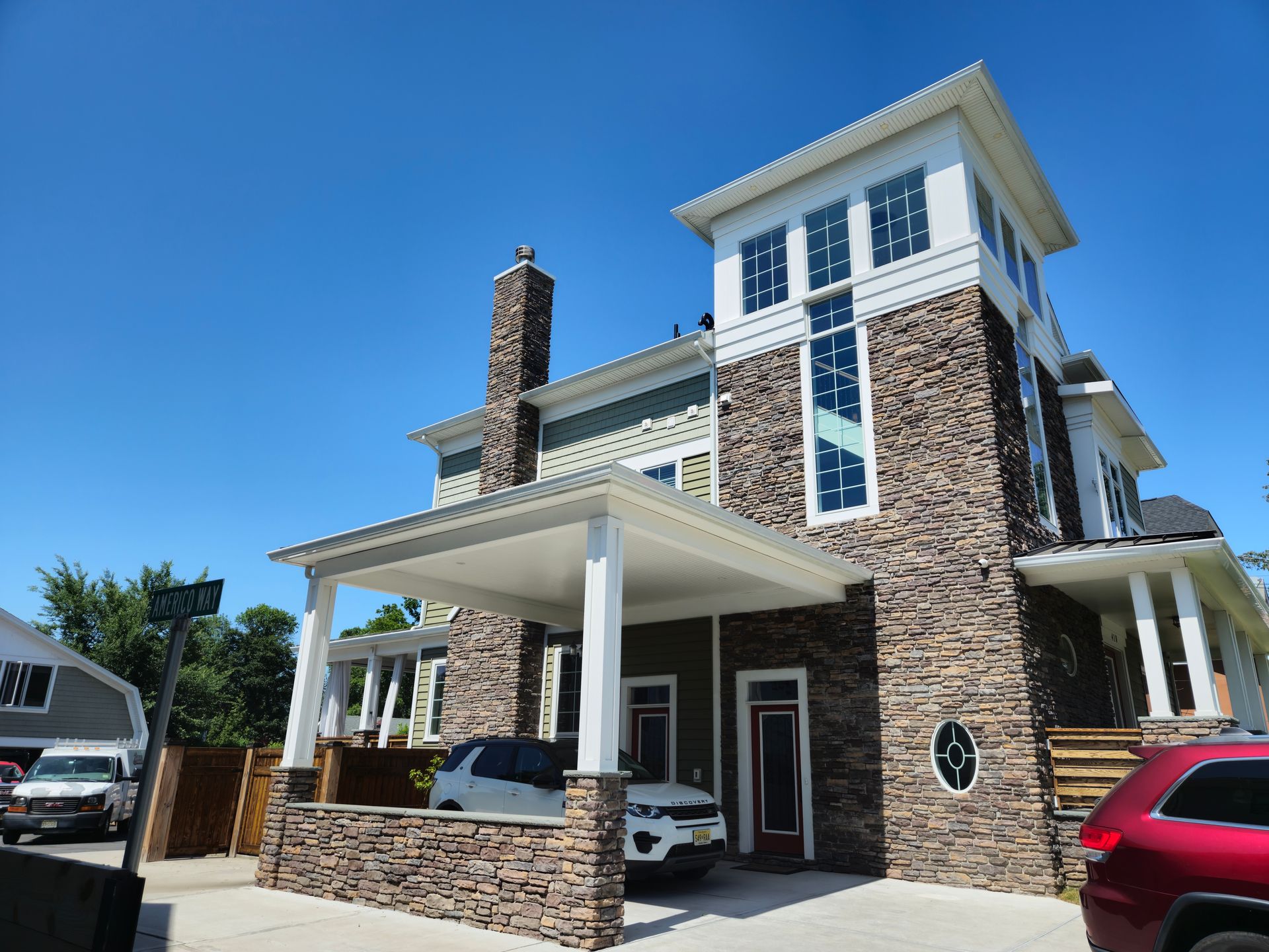 A large house with a car parked in front of it