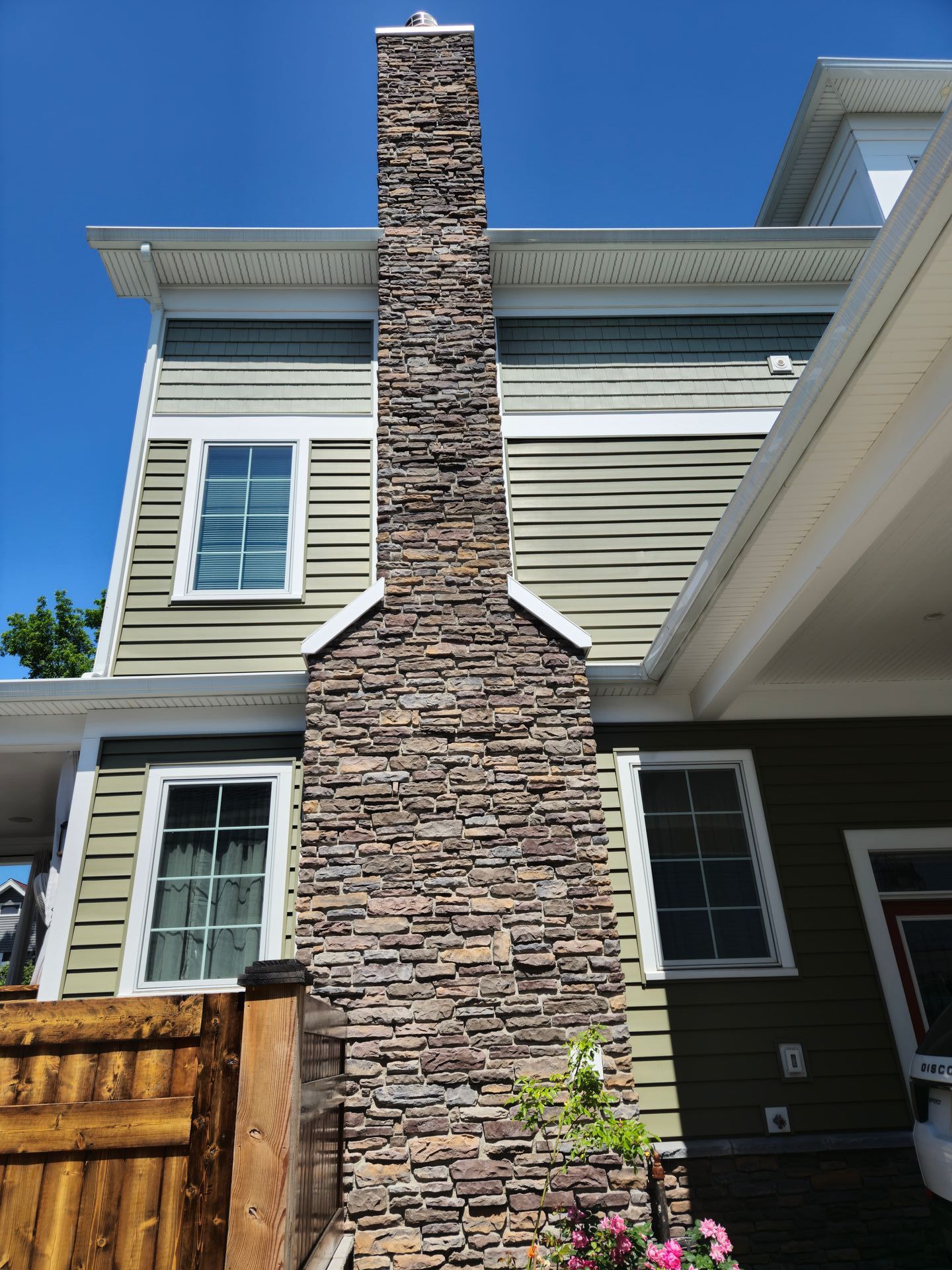 A house with a chimney on the side of it