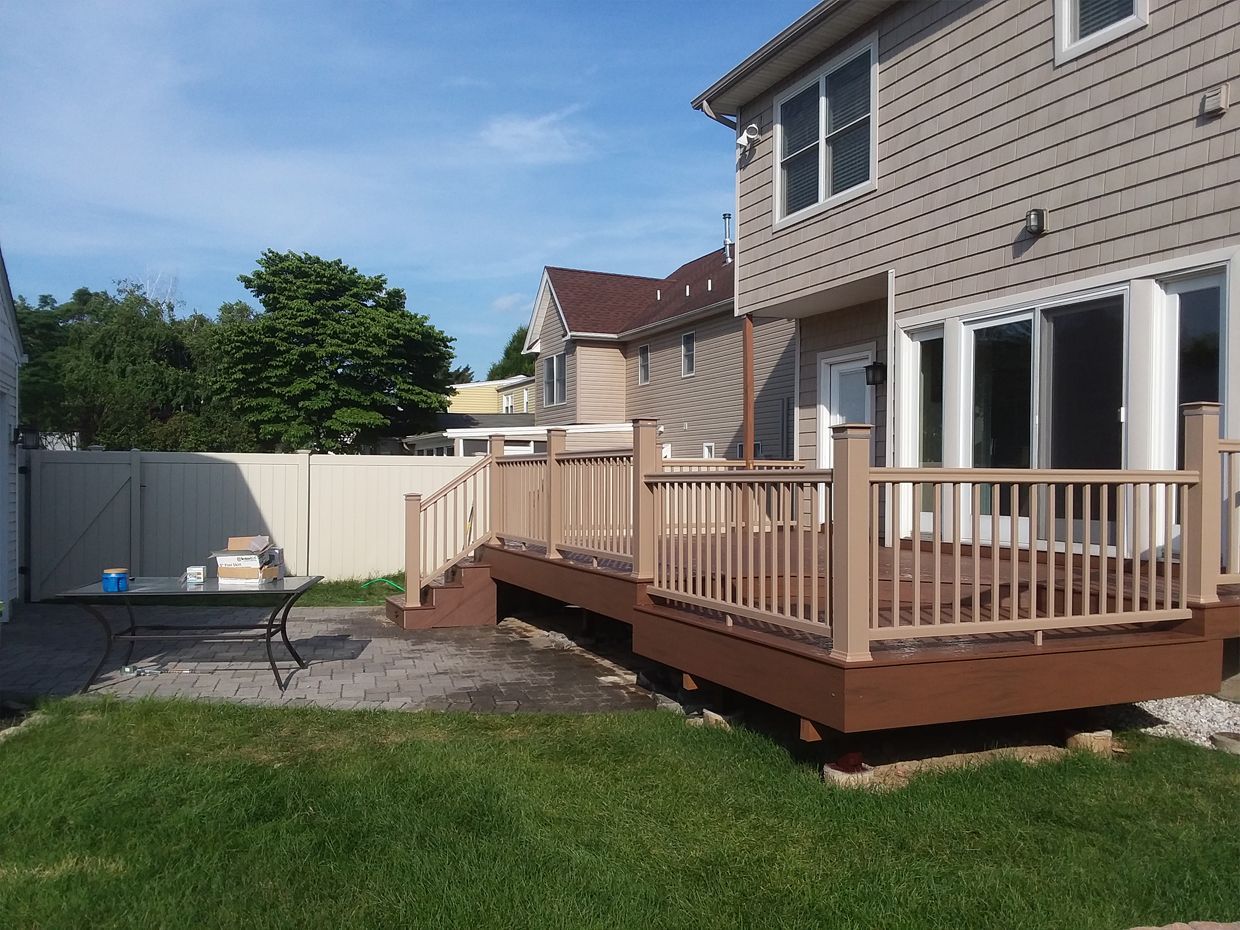 A house with a large deck in the backyard