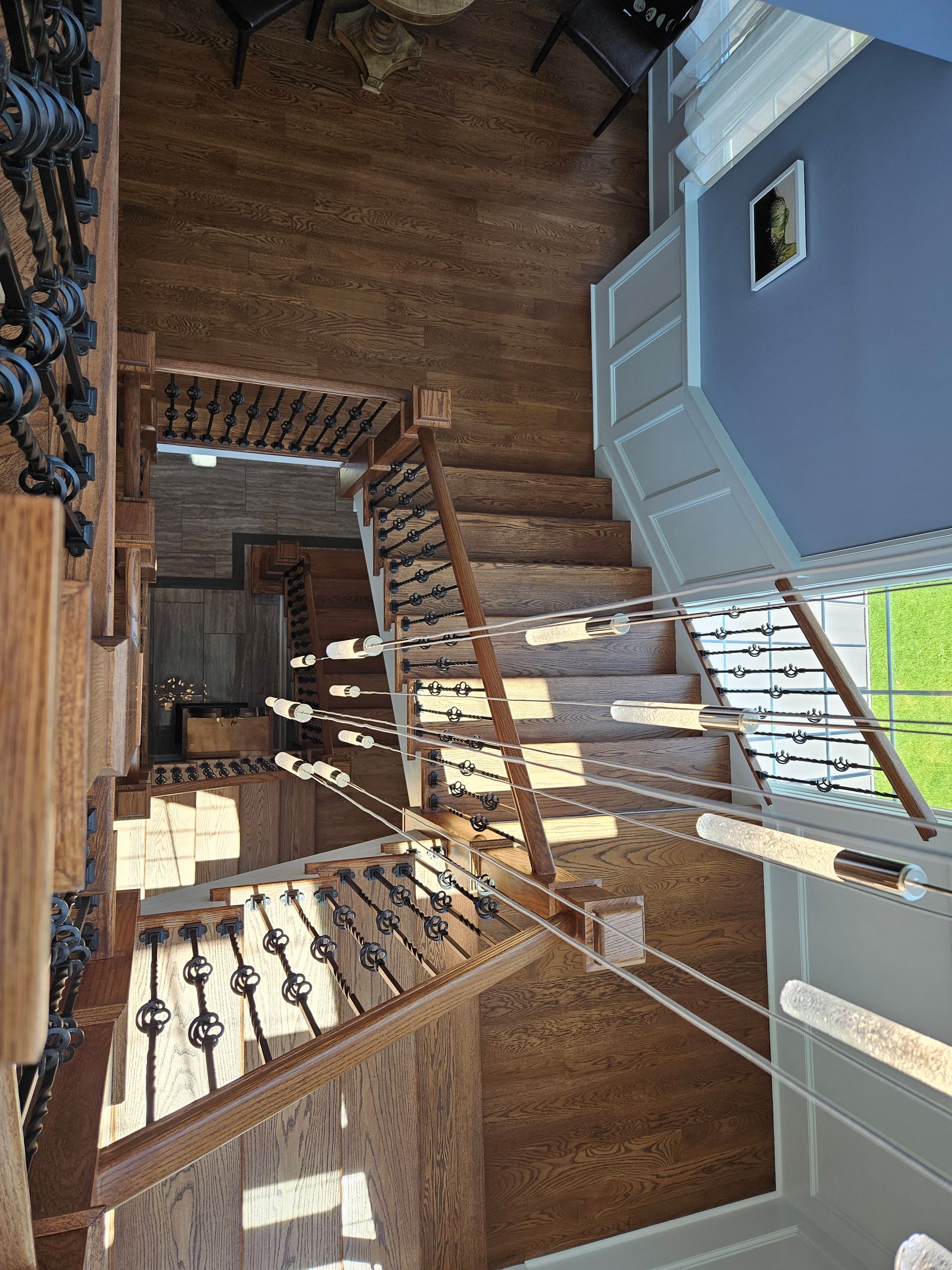 An aerial view of a wooden staircase in a house