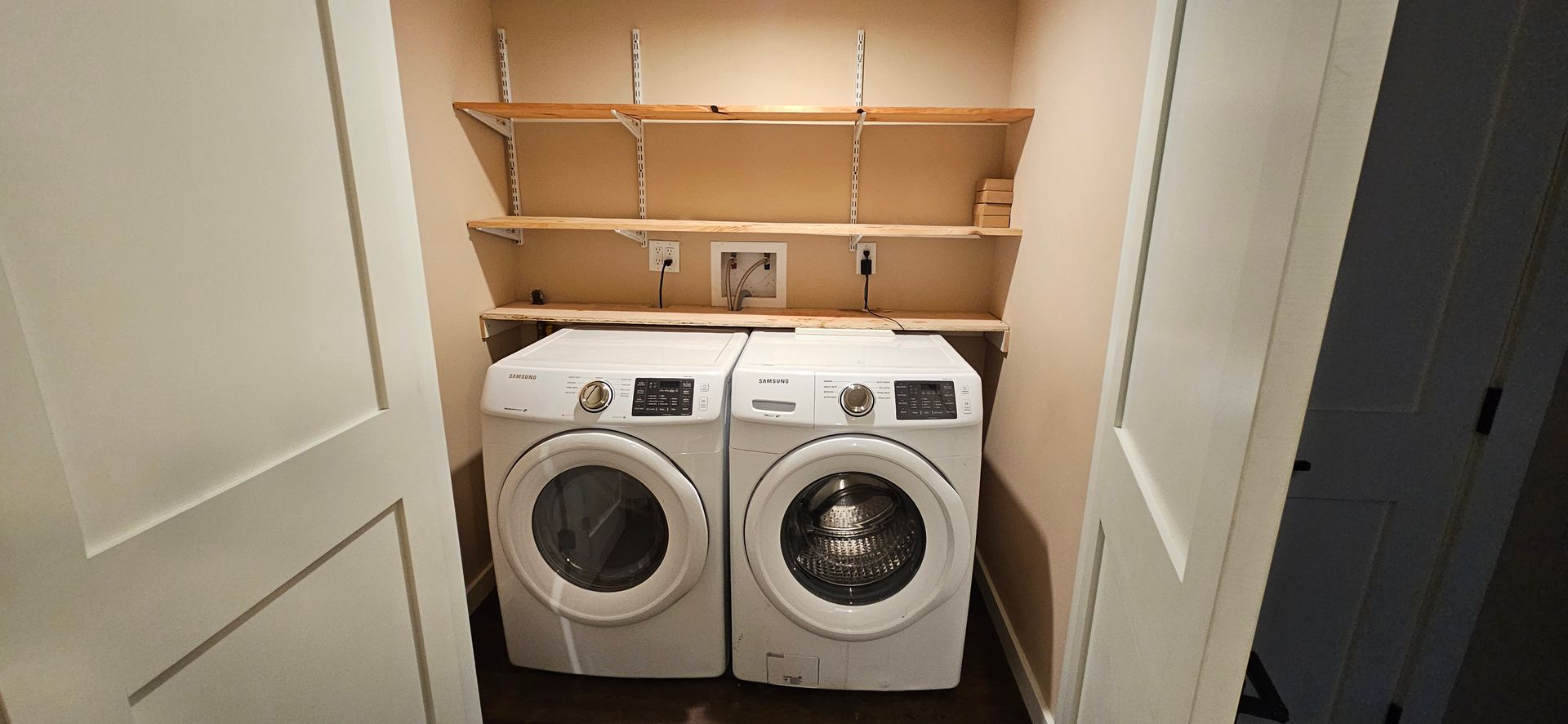 A laundry room with a washer and dryer in it.