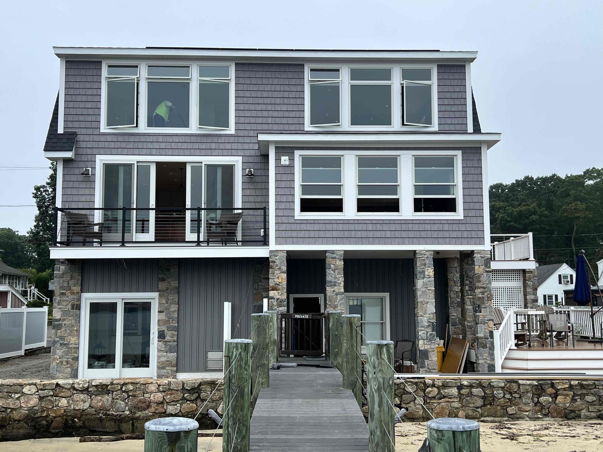 A large house with a dock leading to it