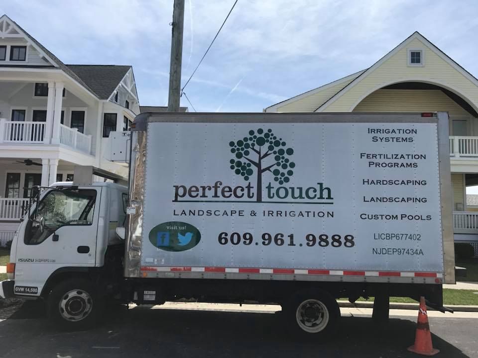 A perfect touch truck is parked in front of a house