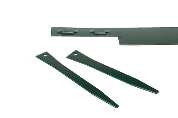 Green metal landscape edging with stakes.