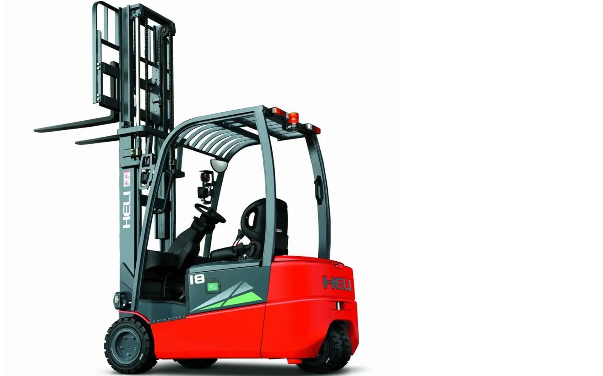 Red and gray forklift with raised forks, outdoors.
