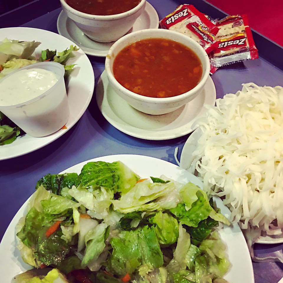 A tray of food with a bag of zesta on it