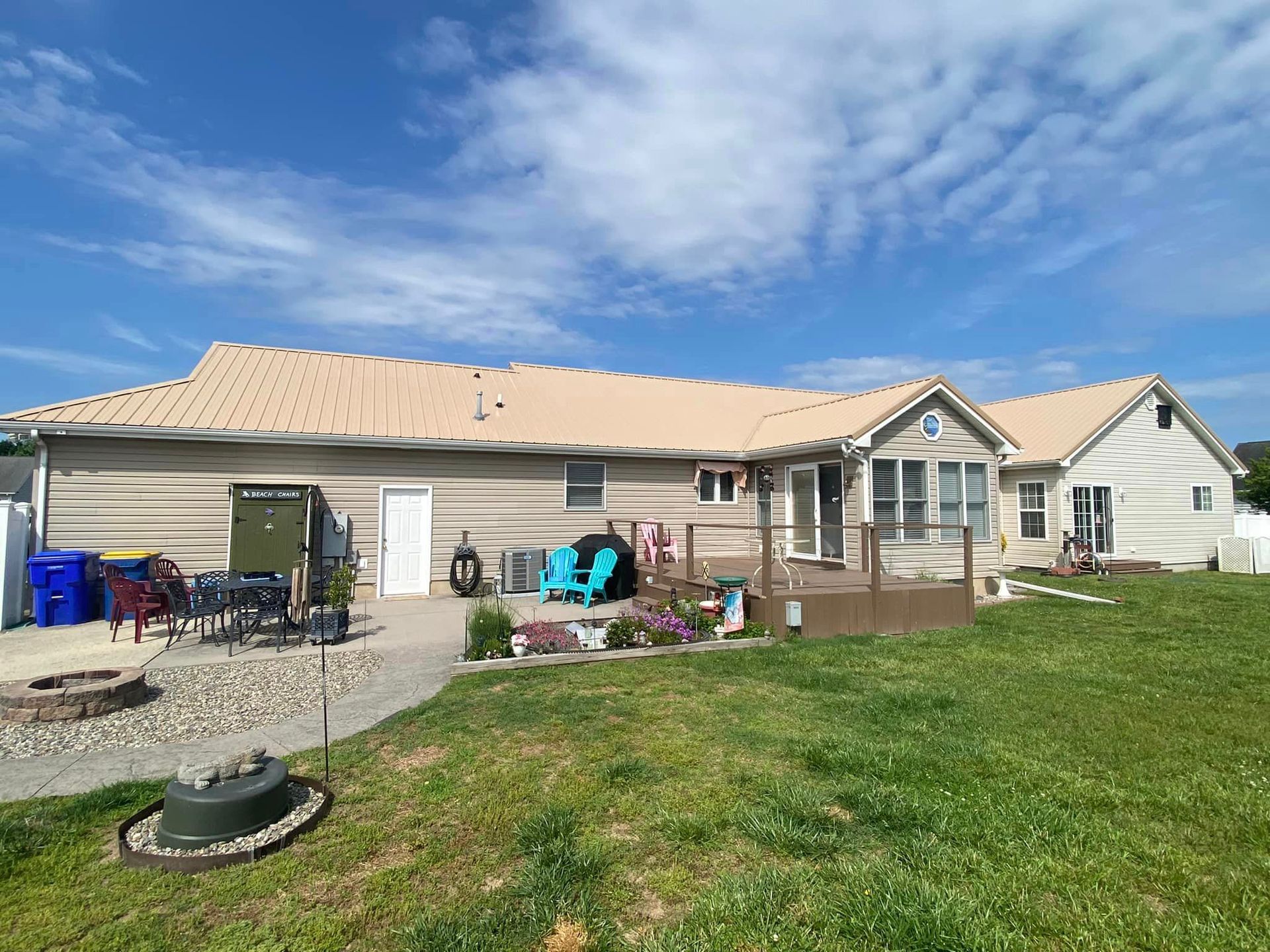 A large house with a large lawn in front of it.
