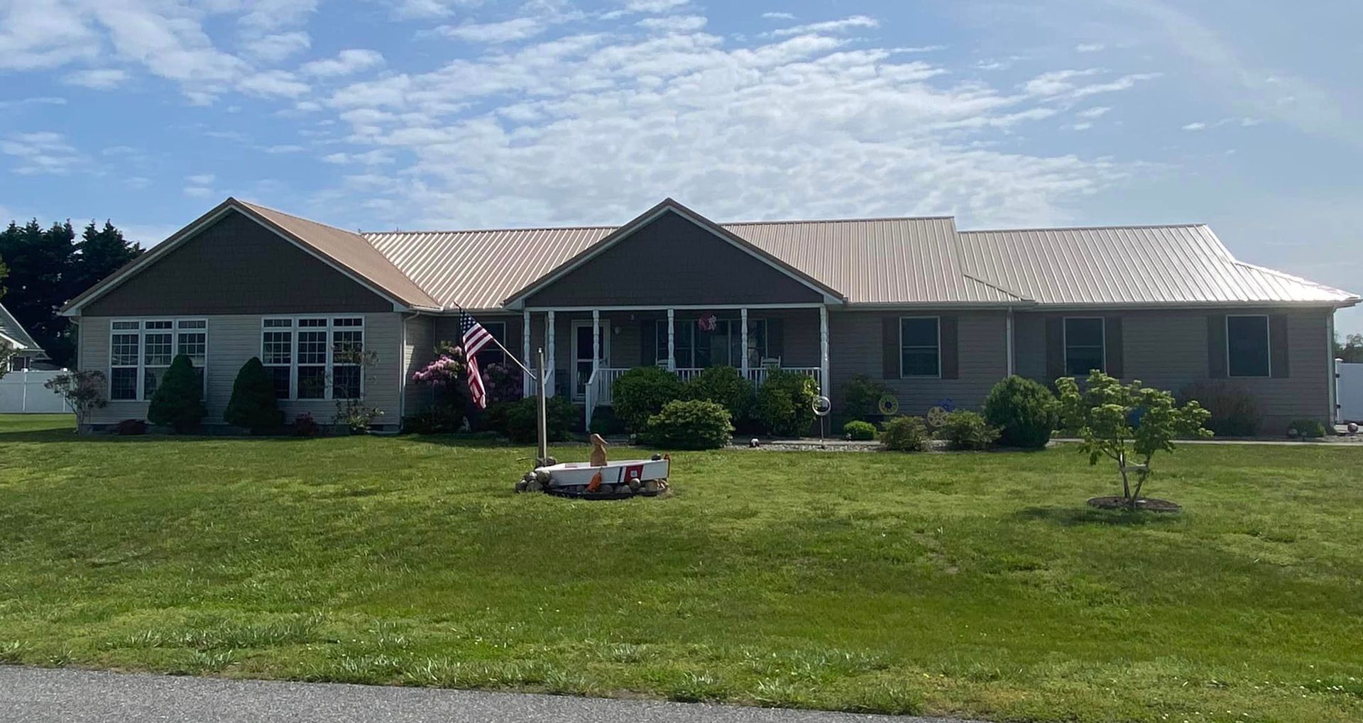 A large house with a large lawn in front of it.