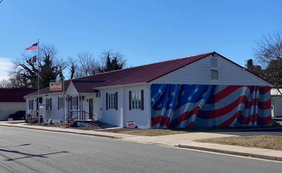 A house with an american flag painted on the side of it