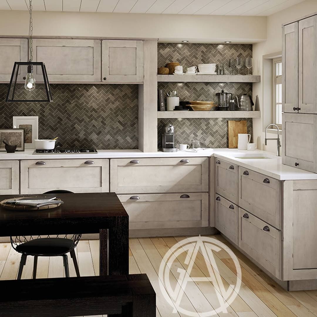 Kitchen with white cabinets, dark tile backsplash, open shelves, and a dark wooden table.