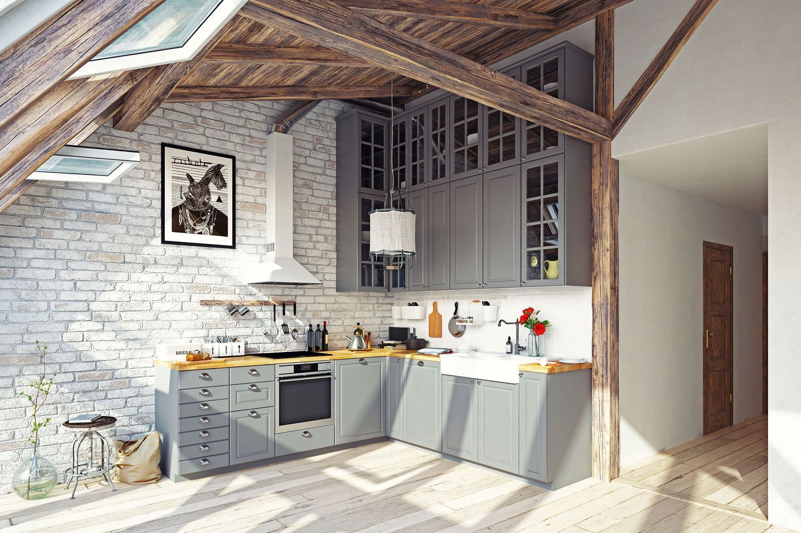 Gray kitchen in a rustic attic with brick wall, wooden beams, cabinets, and appliances.