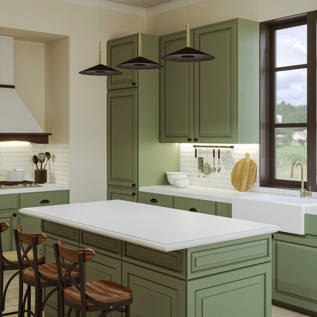 Green kitchen with an island, cabinets, and a farmhouse sink near a window.
