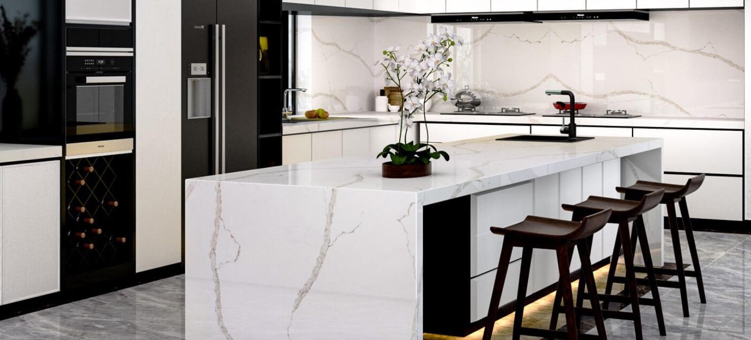Modern kitchen with white countertops and cabinets, dark wood bar stools, and a central island.