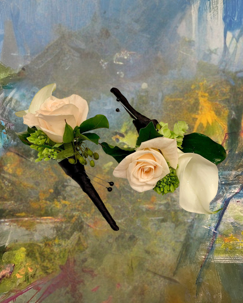 Three cream roses with green leaves on a blurred abstract painted background