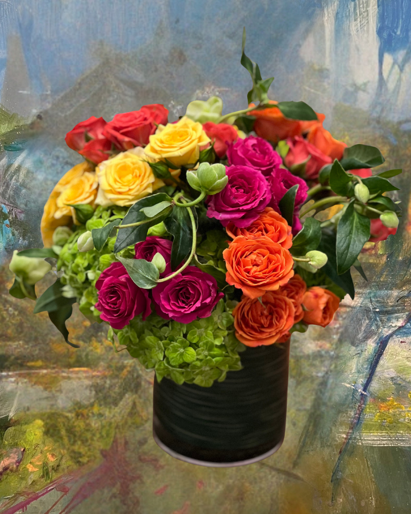 Bouquet of multicolored roses in a black vase against an abstract painted background
