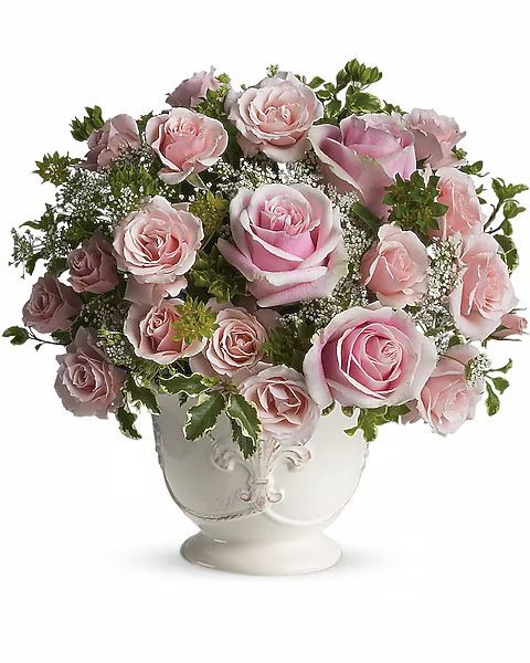 Pink roses in a white vase.