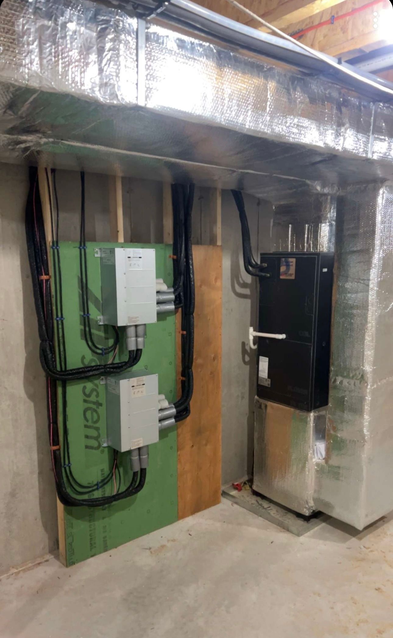 A basement with a heating and cooling system in it.