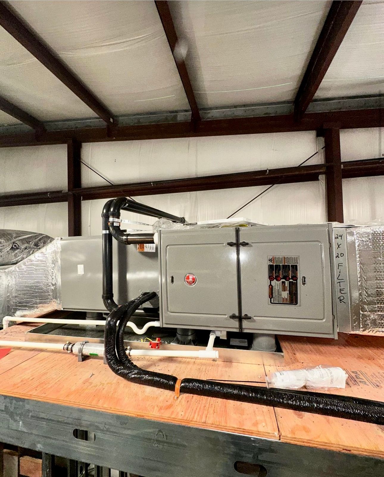 a large electrical box is sitting on top of a wooden floor in a building 